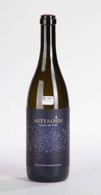 an image of a bottle of wine sitting on top of a table