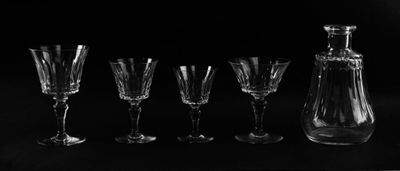 black and white photograph of a set of wine glasses and decanter