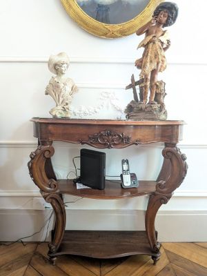 a small table with a statue on top of it