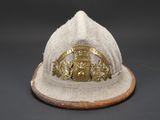 an image of a white hat with a gold emblem on it