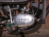 a close up of a motorcycle engine on a street