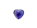 a close up of a purple heart shaped stone on a white surface