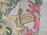 a table cloth with a picture of a bird and flowers on it