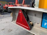 a close up of a sign on the back of a truck
