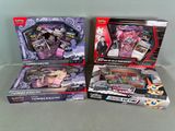 two boxes of pokemon trading cards are sitting on a table