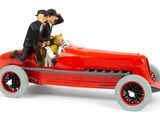 a toy car with a man and a dog in it