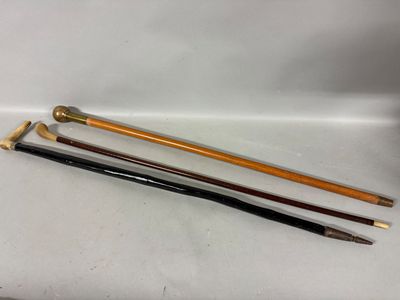 four different types of canes are lined up on a white surface