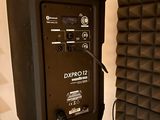 a speaker that is sitting in front of a wall