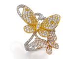 une bague papillon sertie de diamants jaunes et blancs