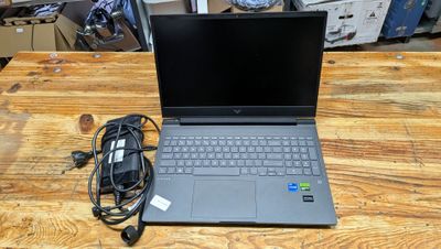a laptop that is sitting on a wooden table