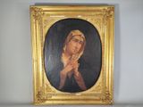 une image représentant un tableau où l'on voit une femme tenant un chapelet