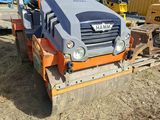 an image of a construction vehicle parked in a lot