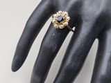a close up of a person ' s hand with a ring on it ' s finger