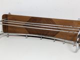 a wooden rack with a metal rack attached to it
