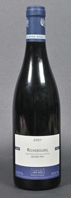 a bottle of wine that is sitting on a table