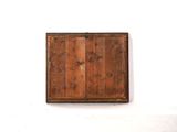 a picture of a wooden box on a white wall
