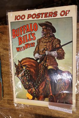 a poster of a man riding a horse on the cover of the book buffalo bill ' s wild west