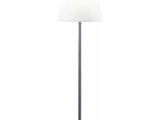the lamp is on a metal base with a white shade