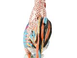 a figurine of a rooster on a white background