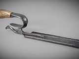 a close up of a pair of tonges with a wooden handle