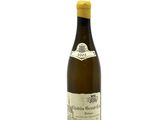 a bottle of wine that is sitting on a table