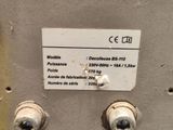 a label on the back of a machine that is on display