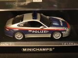 a toy police car in a box on a table