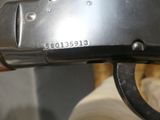 a close up of a gun that is on display