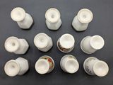many cups and saucers sitting on a table