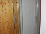 a toilet and a shower in a small bathroom