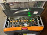 an orange and black box with a bunch of wires inside of it