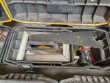 a tool case with tools inside of it on the floor