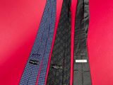 three men ' s neck ties on a red background