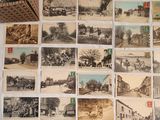a lot of old photos on the wall of this room