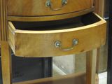 two wooden drawers that are open on a stand