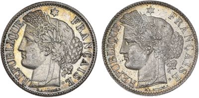 a silver coin with an image of a woman ' s head on it