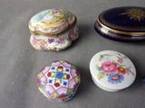 several different types of decorative boxes are sitting on a table