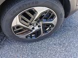 a close up of a car ' s tire on the pavement