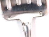 a close up of a spatula on a white surface