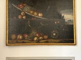 a painting on the wall above a door in a room