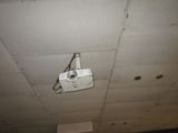 a camera mounted on the ceiling of a building