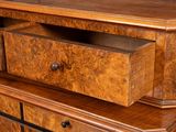 a wooden dresser with two drawers on top of it