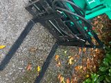a lawn mower that is laying on the ground