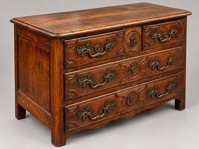 a wooden chest of drawers with ornate carvings on the drawers