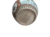 a picture of a vase with a design on it