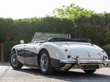an image of a classic sports car parked in a parking lot