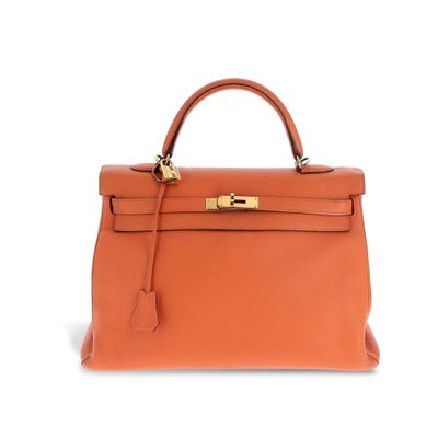 a brown leather handbag on a white background