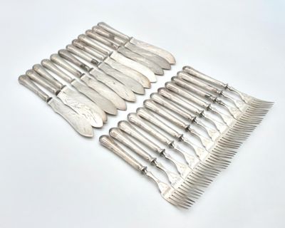 a lot of silverware on a table with a white background