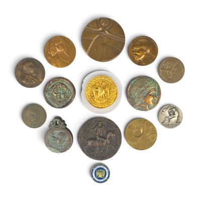 a close up of a group of coins on a white surface