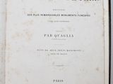 an open book on a white table with a black border